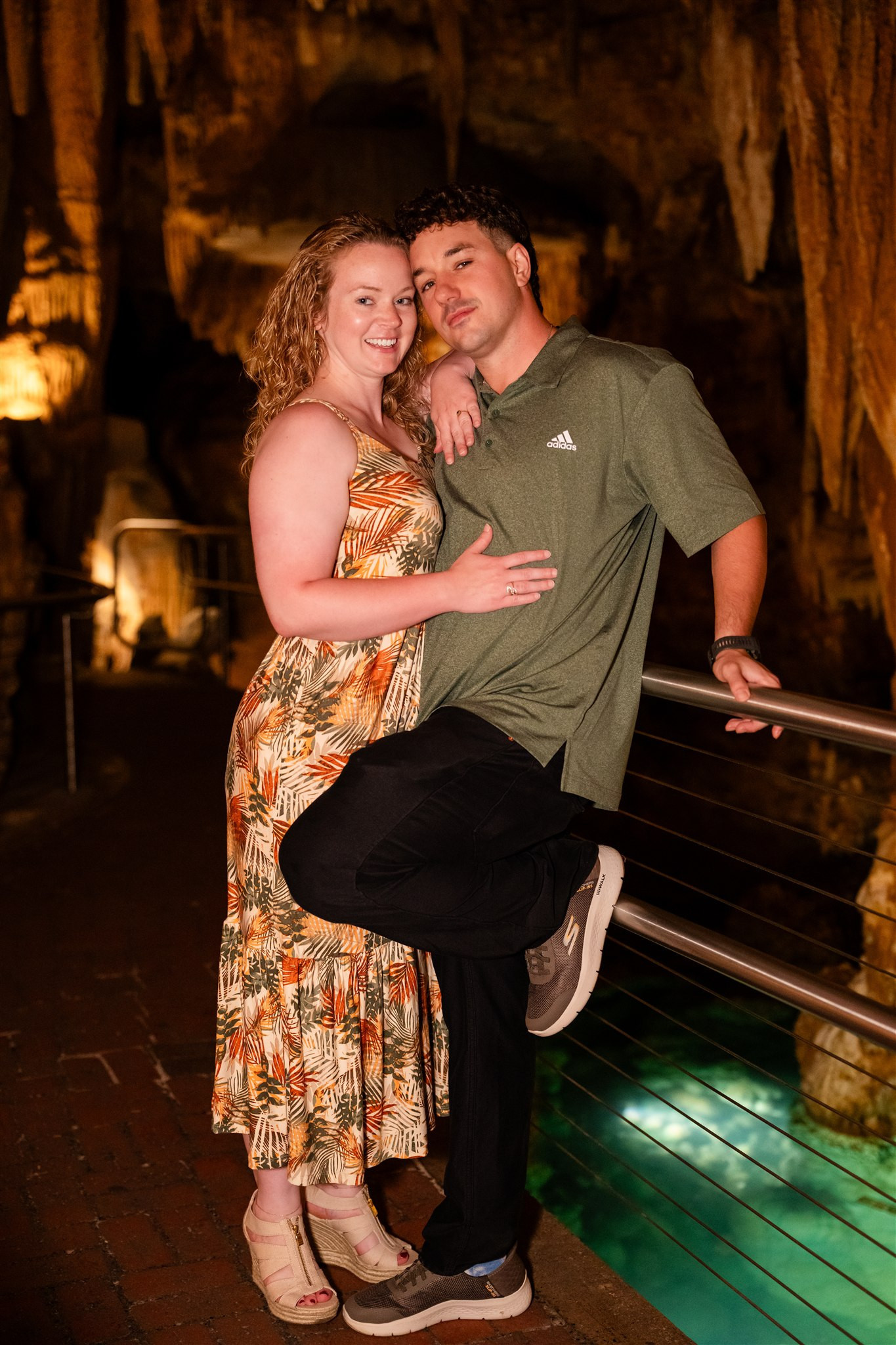 Couple poses in Luray Caverns with water feature, Cathedral Room location.