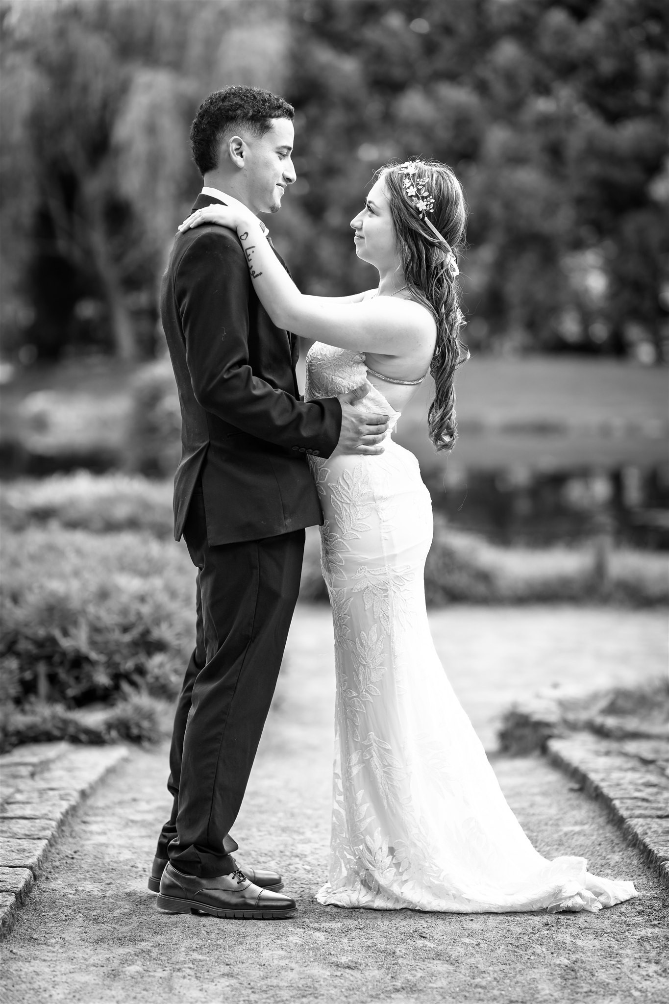 Bride and groom embrace in a Japanese garden at Maymont for Richmond elopement.