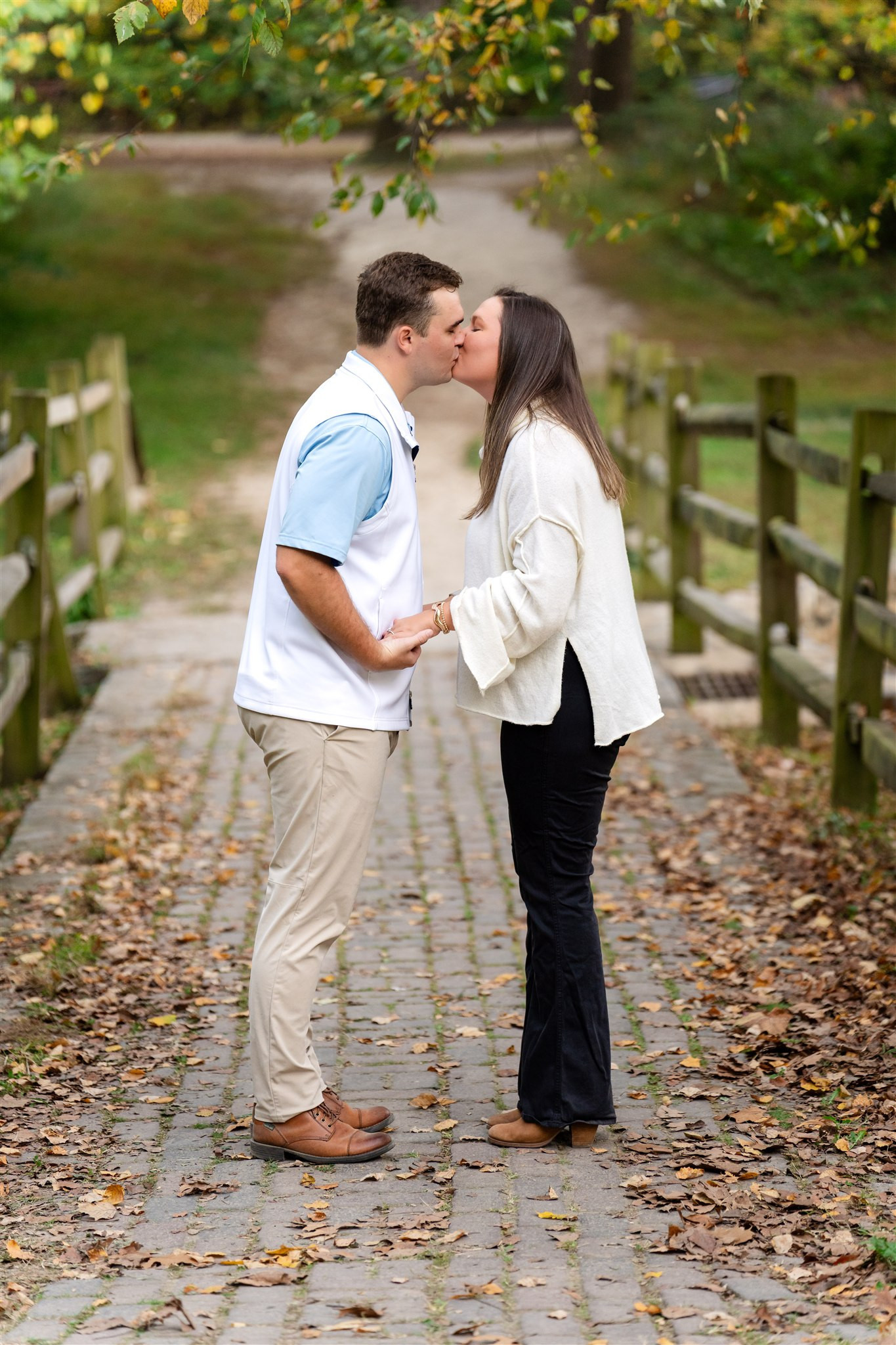 Couple kissing on a bridge at Bryan Park, Richmond VA