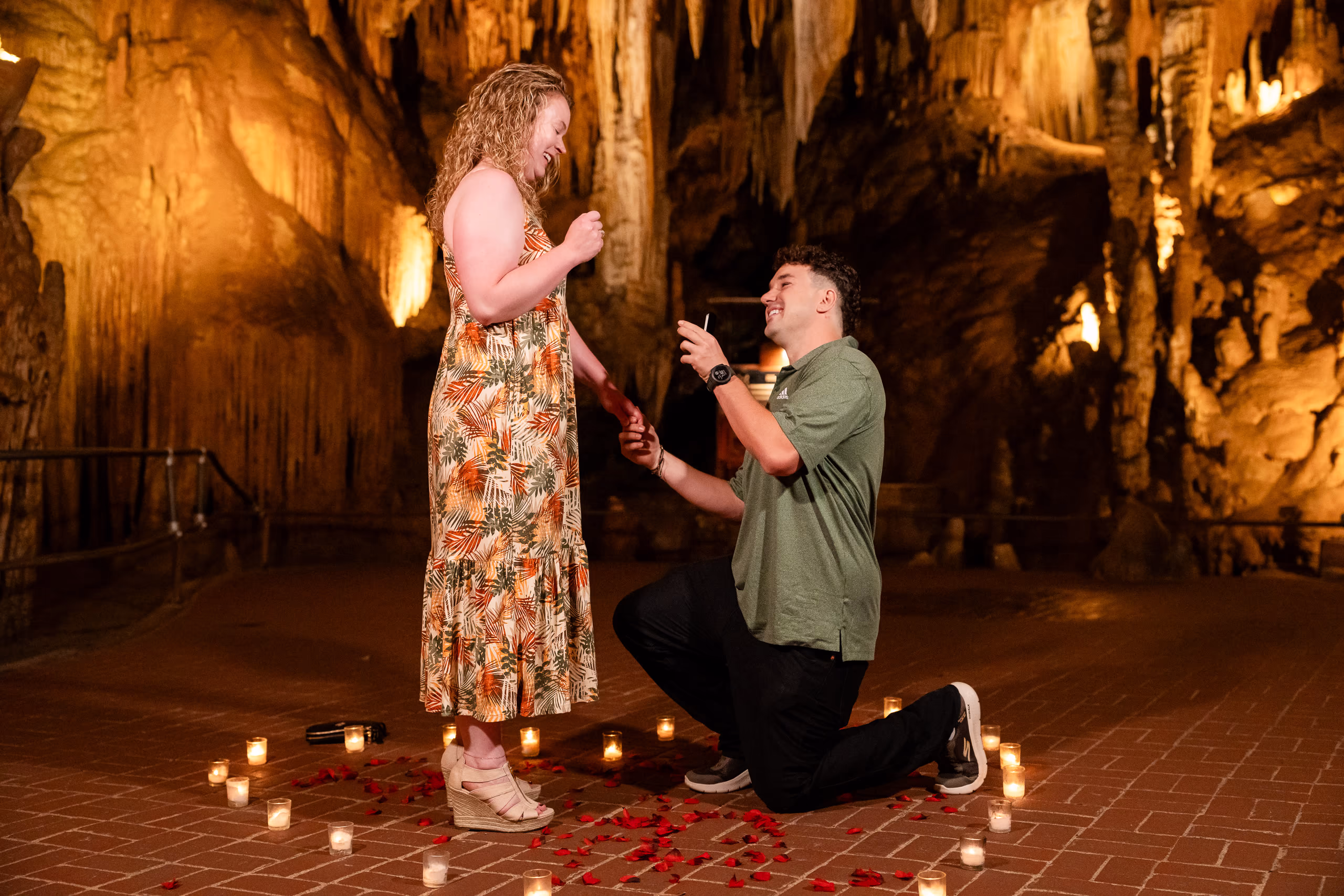Man proposing to woman in a candlelit cave