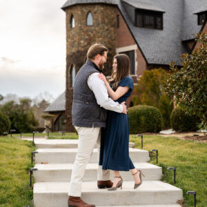 Couple embracing on steps of stone building